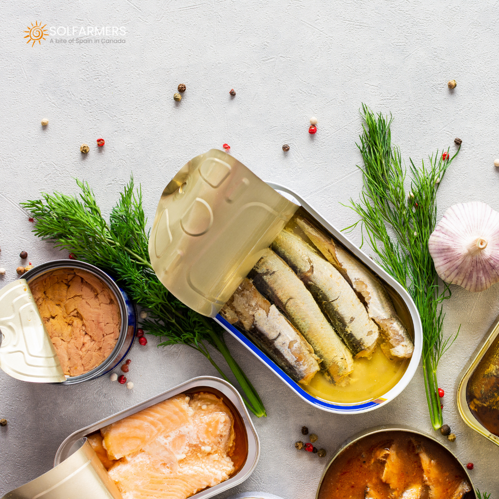 A selection of canned seafood preserves, such as sardines, clams and razor clams, arranged on a kitchen table. The cans are open, showing the delicious contents and detailed labels in the foreground.