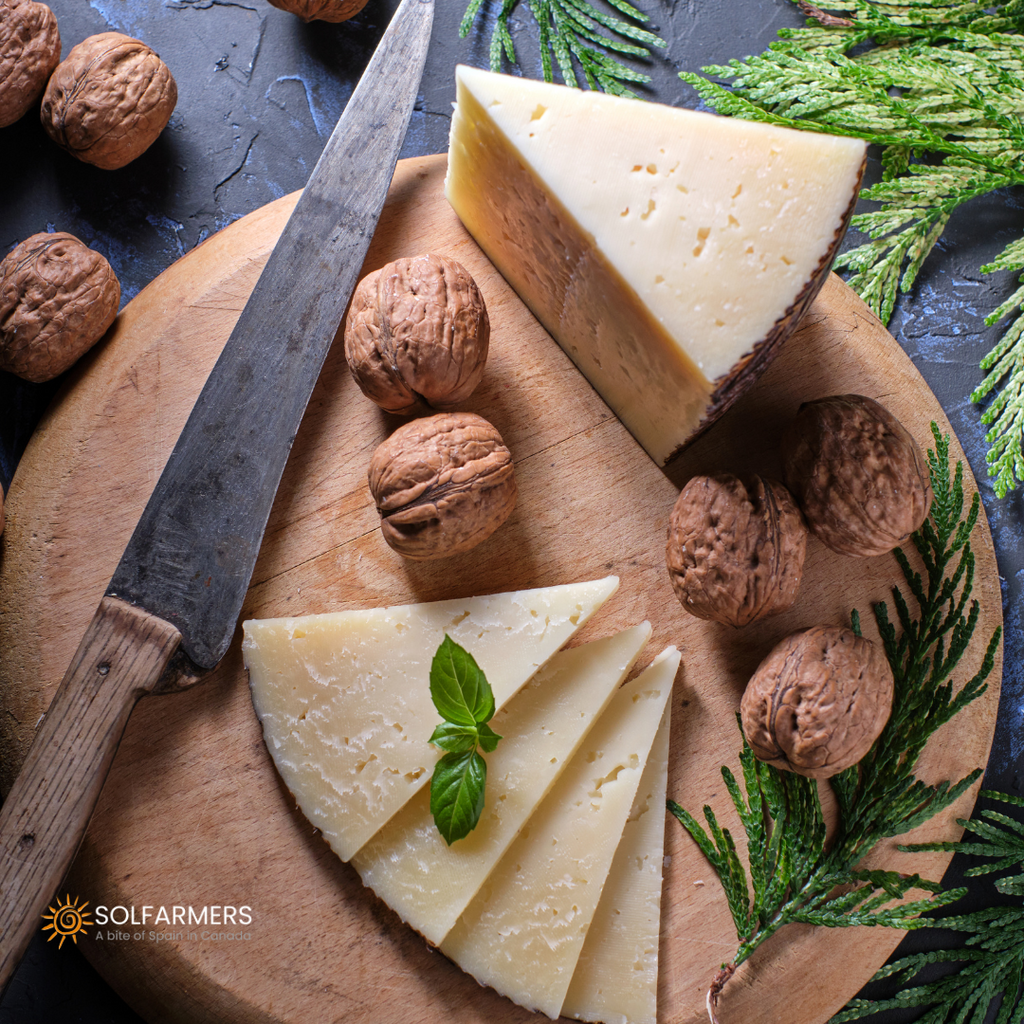 Manchego cheese board cured in Solfarmers, with nuts. Gastronomic presentation of Spanish cuisine in Canada.