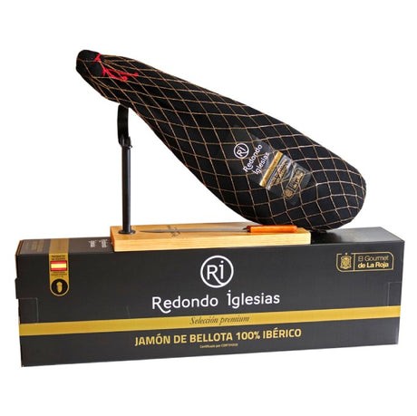 Iberian Bellota ham set with a stand, available in Canada, featuring high-quality ham with rich marbling and an elegant presentation stand.